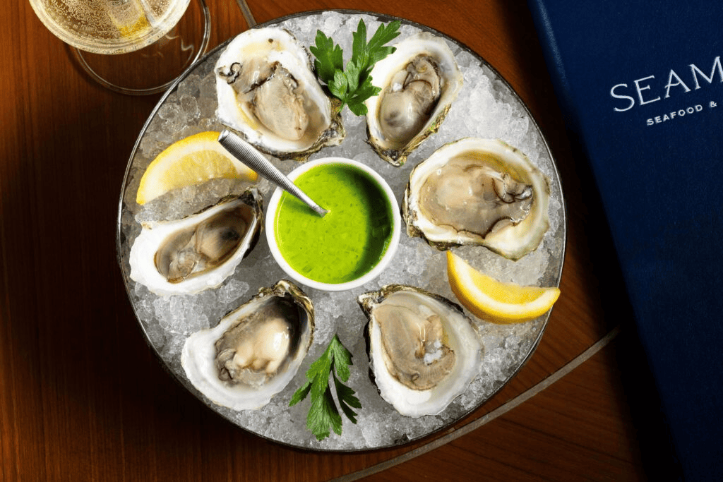 Mastering the Art of the Raw Bar in Boston A plate of oysters on ice from Seamark.